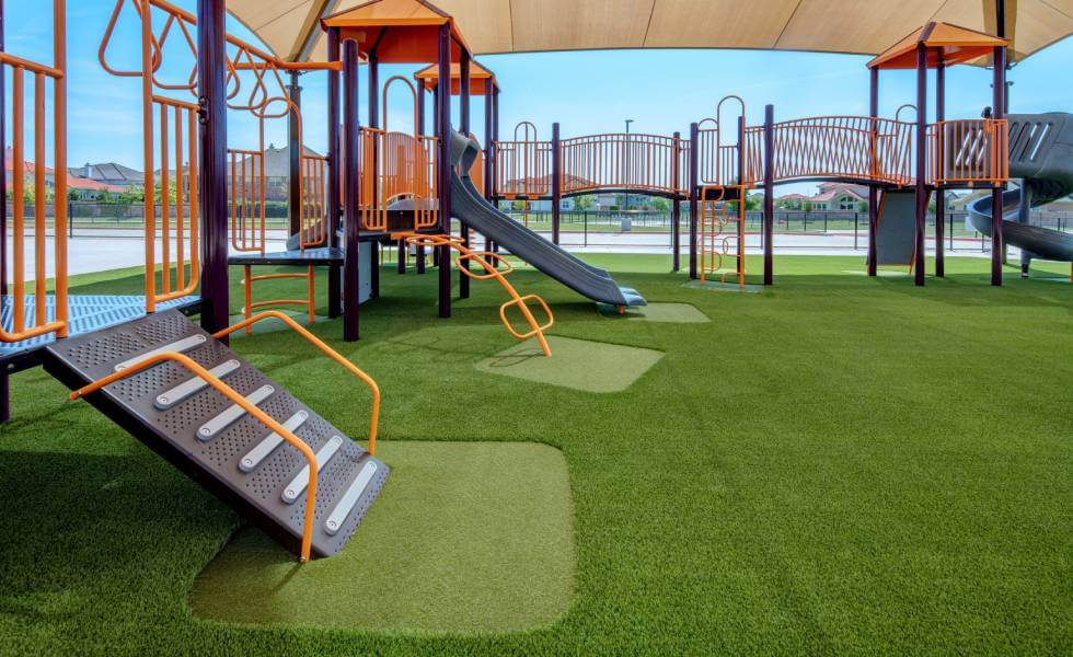 Jungle gym installed in Frisco Independent School District on SYNLawn artificial grass