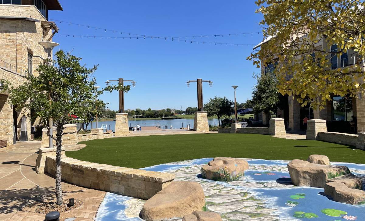 Distant lake in view of the Boardwalk Towne Artificial grass project
